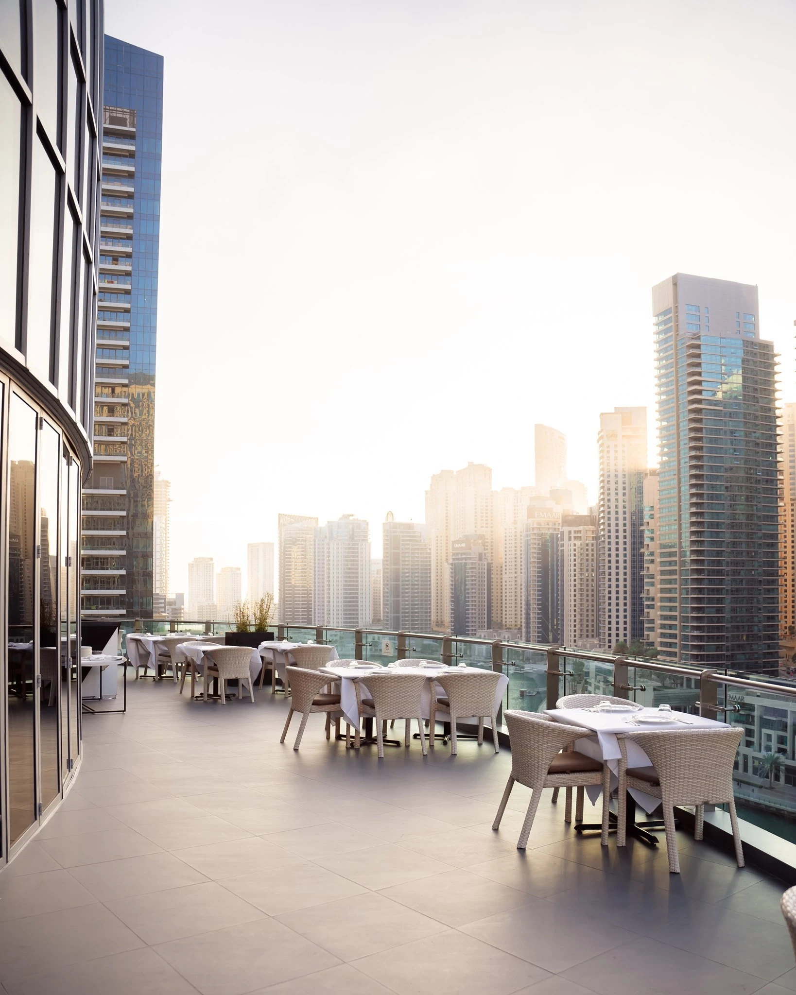 Atelier M rooftop dining with Dubai skyline view.