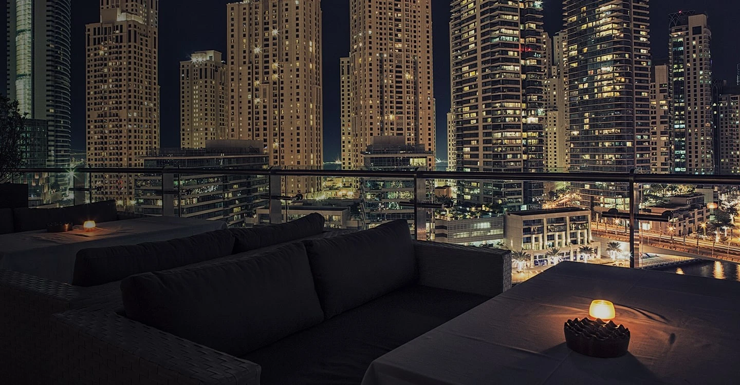 Atelier M rooftop view of Dubai skyline at night.