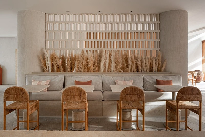 Mythos Urban Greek Eatery interior with woven chairs, Dubai.