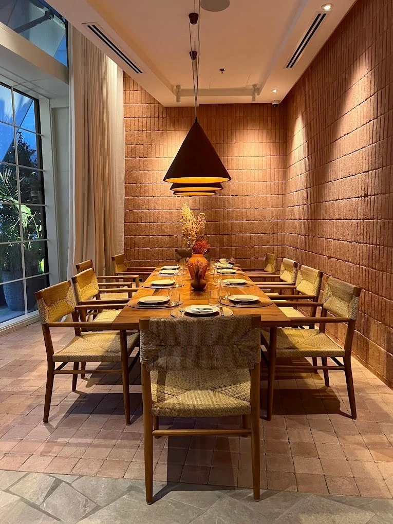 Elegant dining setup at Mythos Urban Greek Eatery, Dubai.