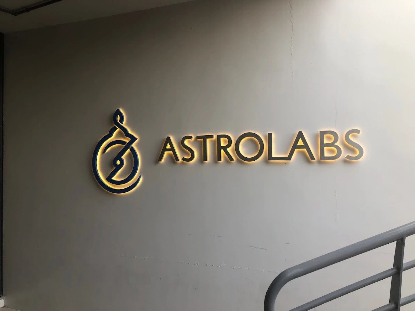 AstroLabs Coworking Space sign on wall, Dubai location.