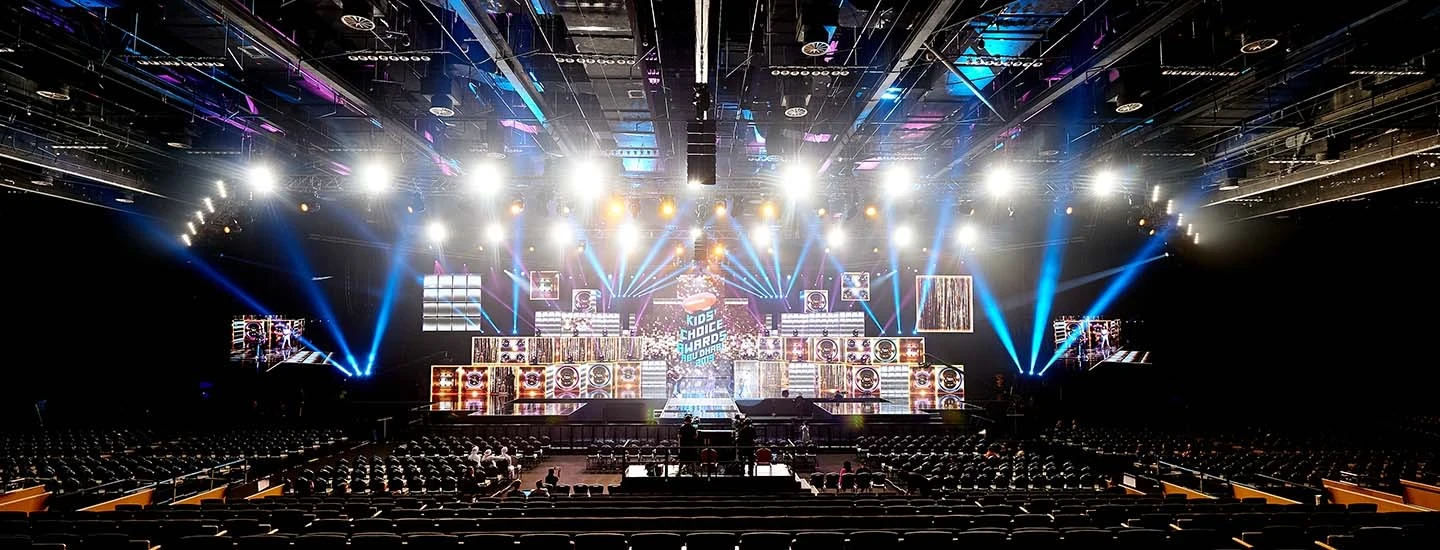 ADNEC Centre Abu Dhabi stage with colorful lights and seating.