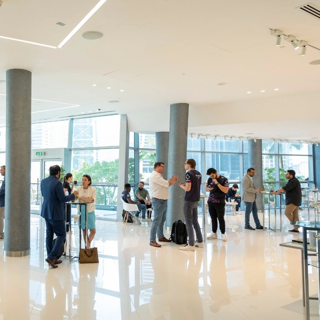 People networking at Almas Conference Centre, Dubai.