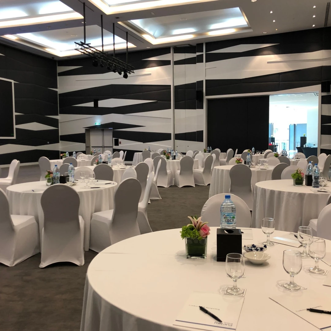 Almas Conference Centre Dubai, elegant round tables set for event.