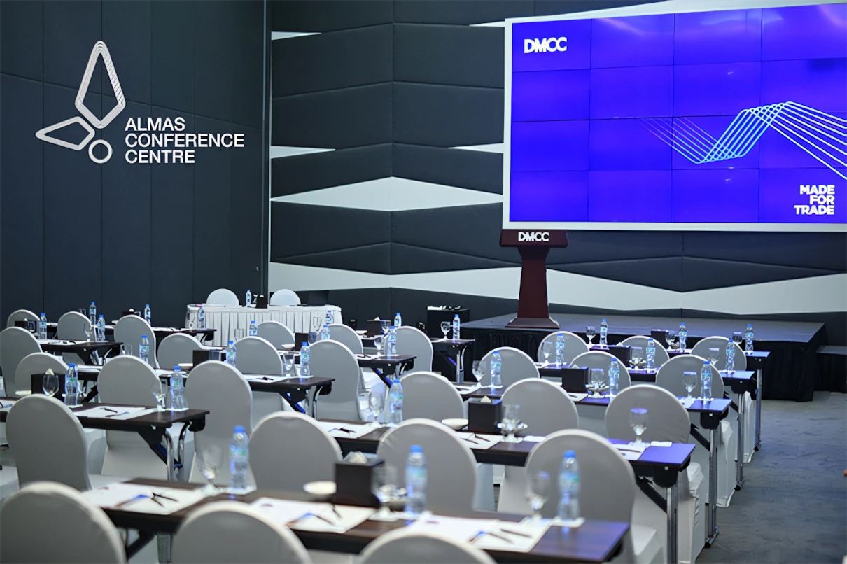 Almas Conference Centre auditorium setup with chairs and tables, Dubai.