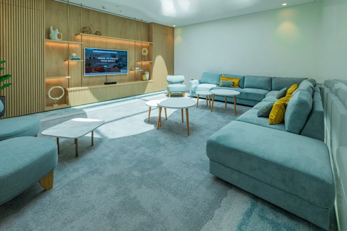 Stylish lounge with blue sofas, Cloud Spaces Circle Mall Dubai.