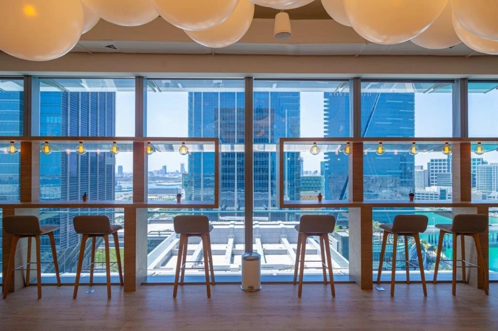 Modern coworking space with city view at Cloud Spaces ADGM, Abu Dhabi.