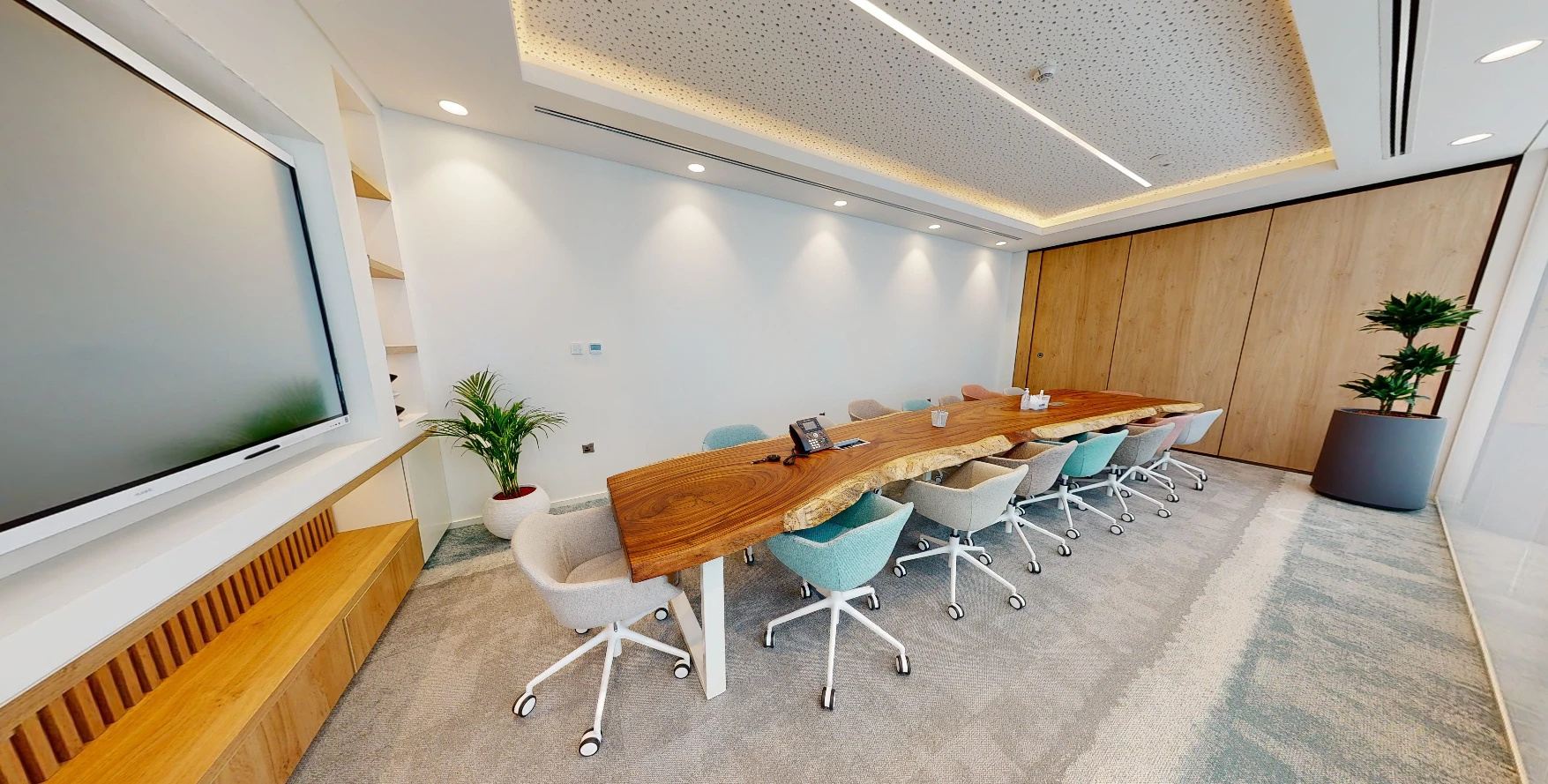 Spacious meeting room with large screen, Cloud Spaces Circle Mall Dubai.