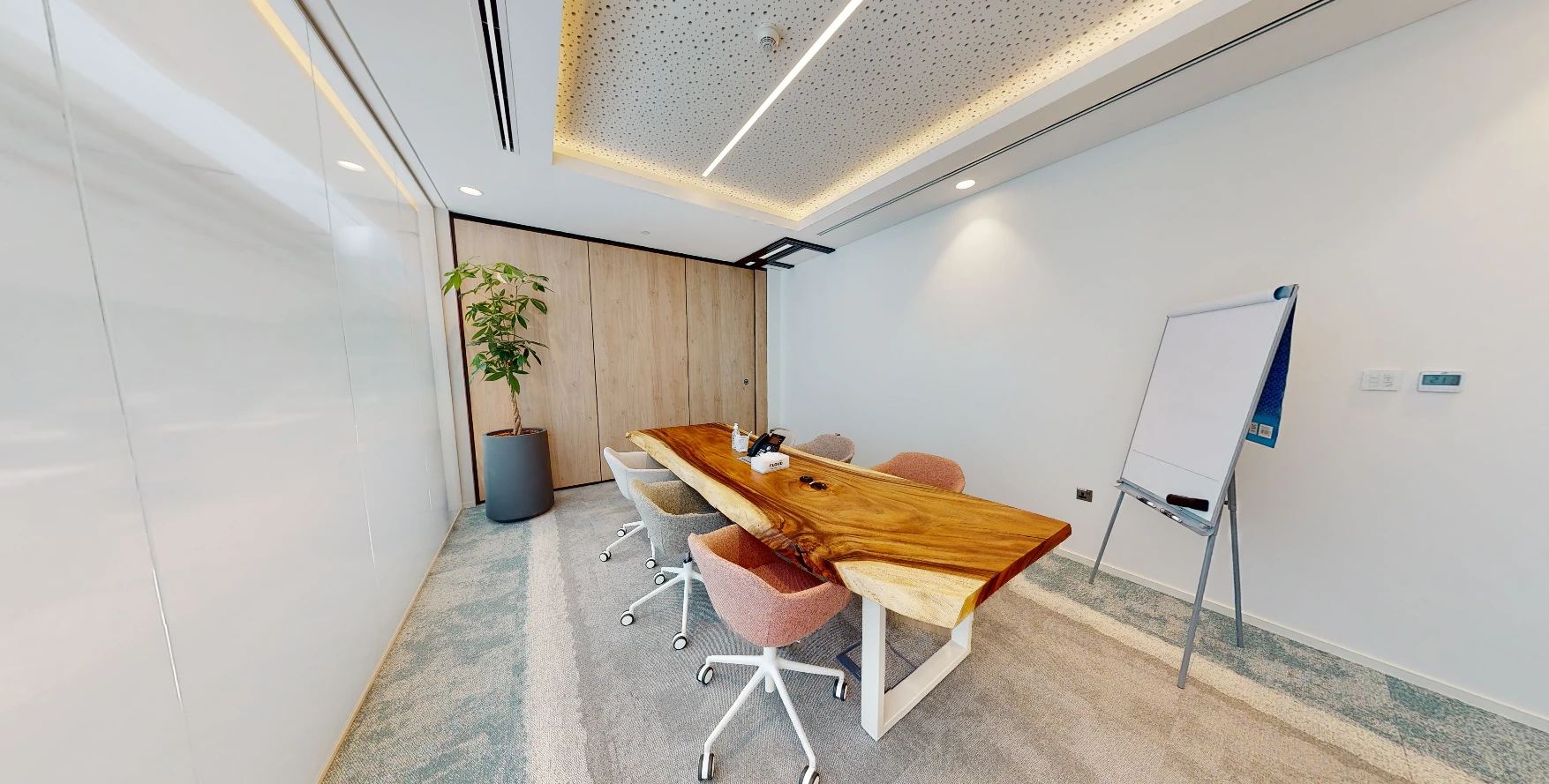 Elegant meeting room with wooden table, Cloud Spaces Dubai.