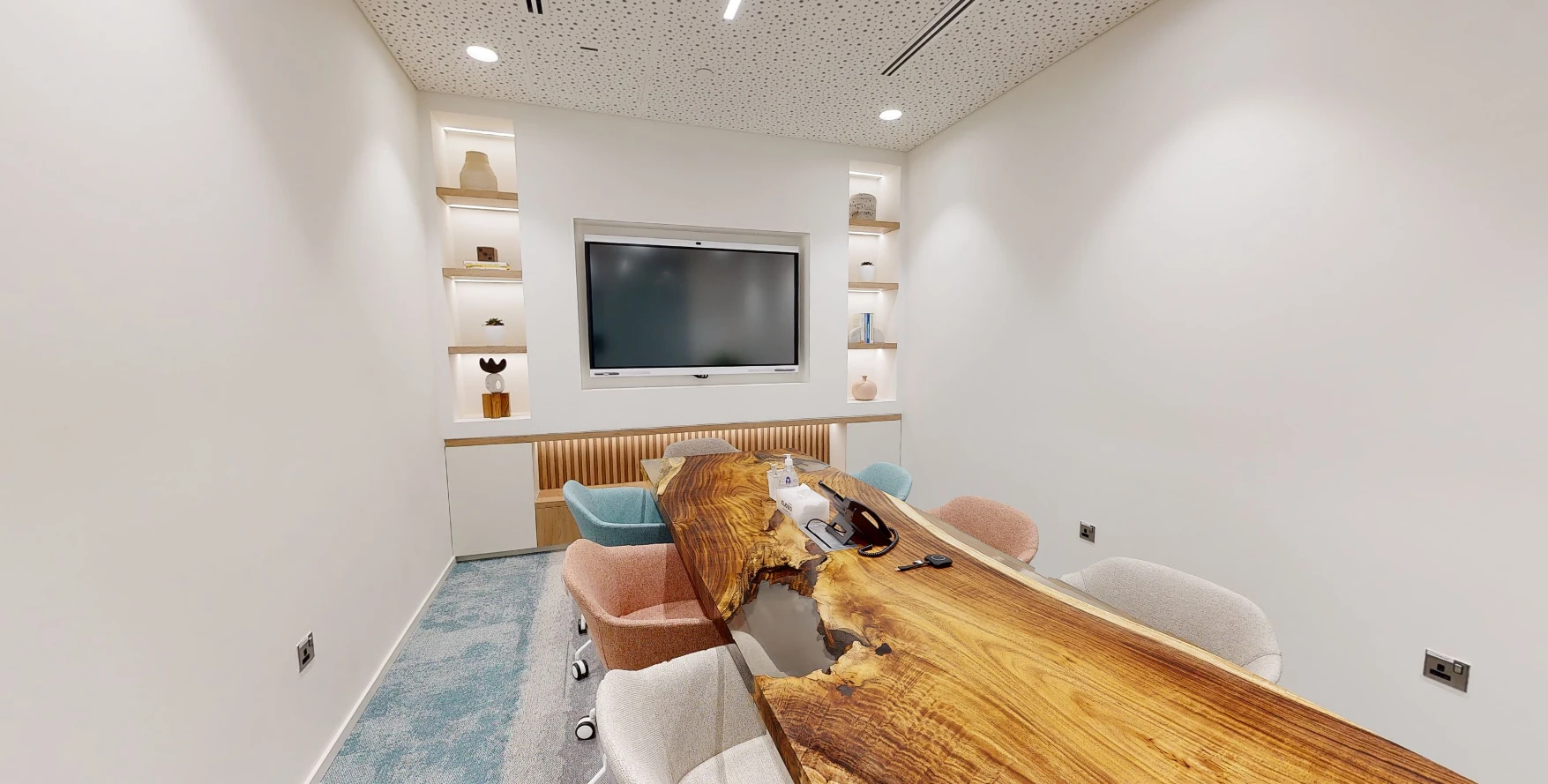 Modern meeting room at Cloud Spaces Circle Mall Dubai, wooden table centerpiece.