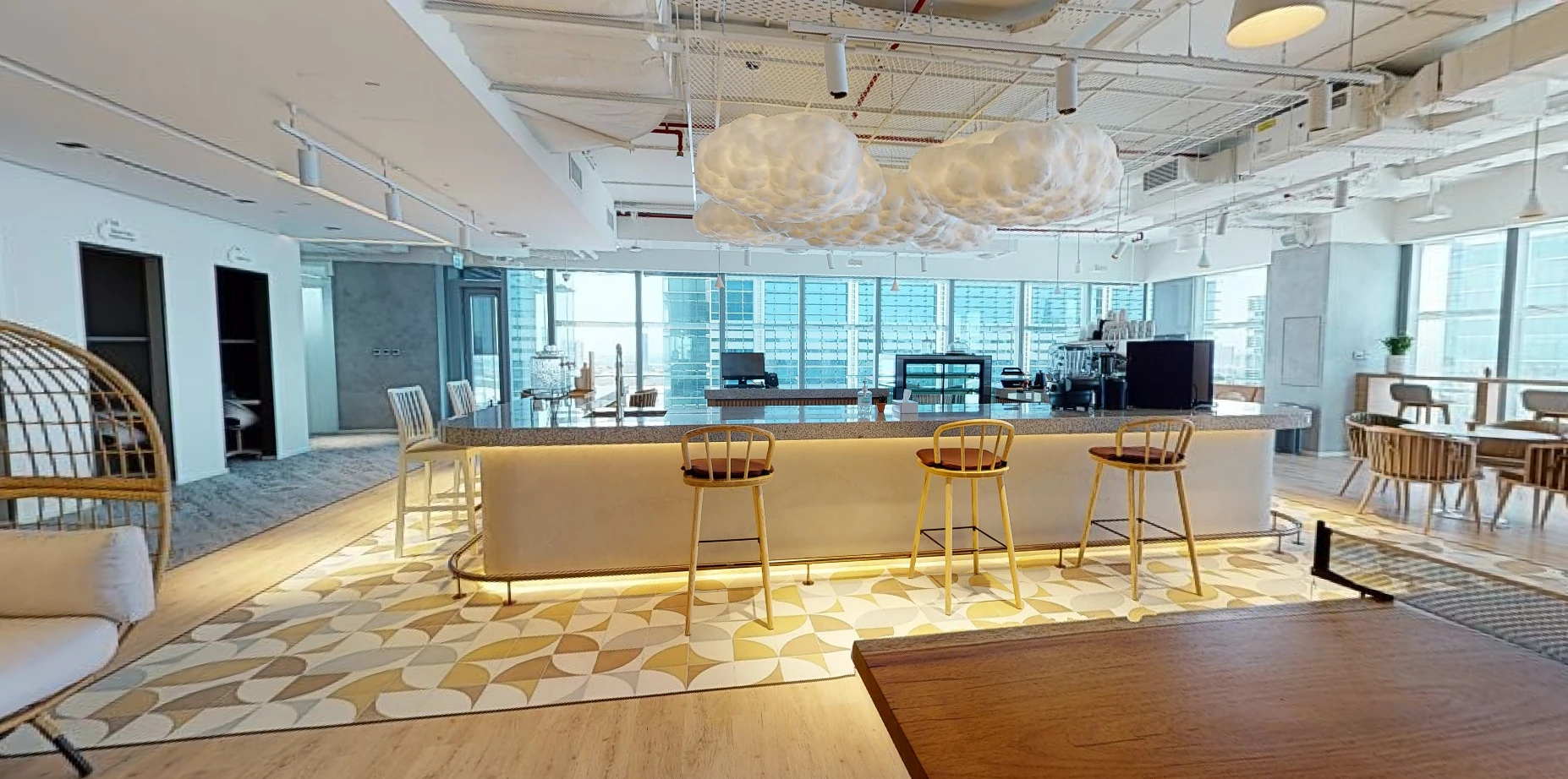Modern workspace with bar stools, Cloud Spaces ADGM, Abu Dhabi.