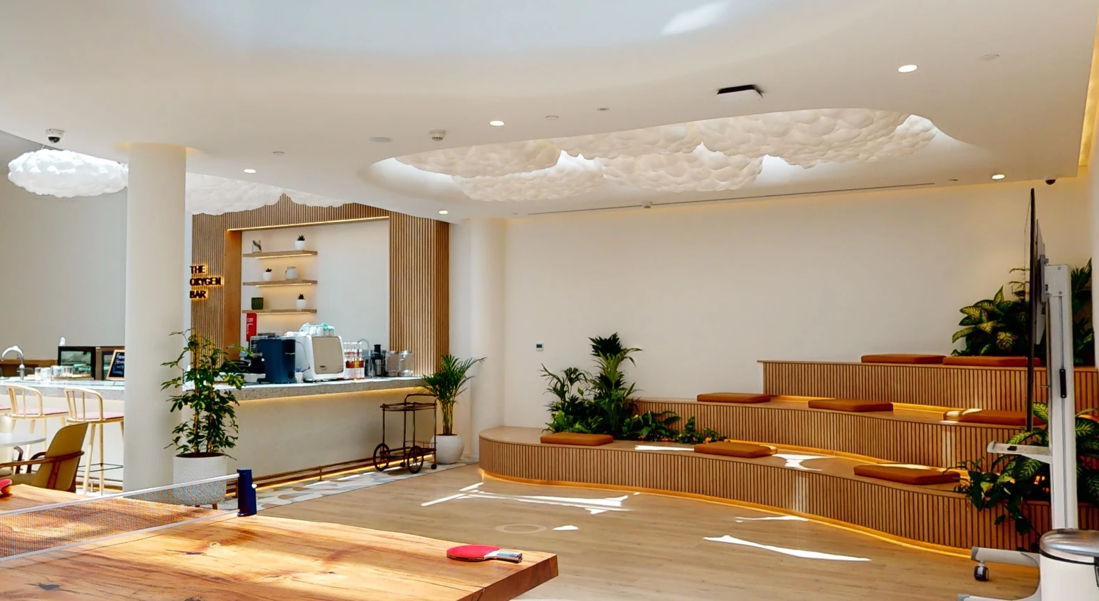 Modern lounge with seating and plants at Cloud Spaces Circle Mall Dubai.