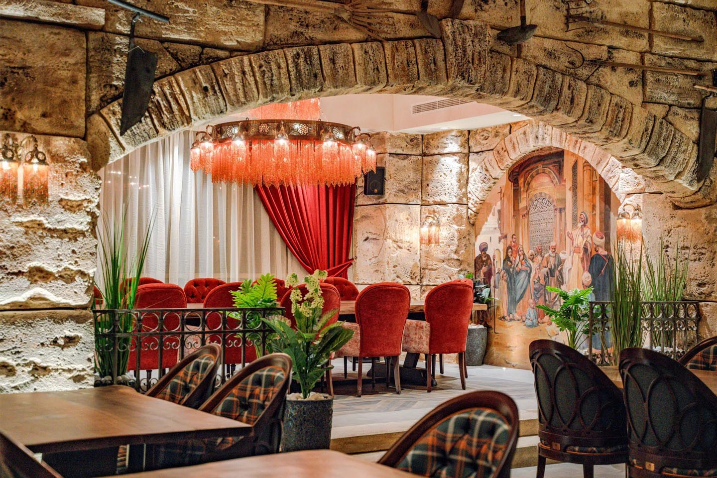 Elegant dining area with red chairs, Al Meshwar Restaurant Dubai.