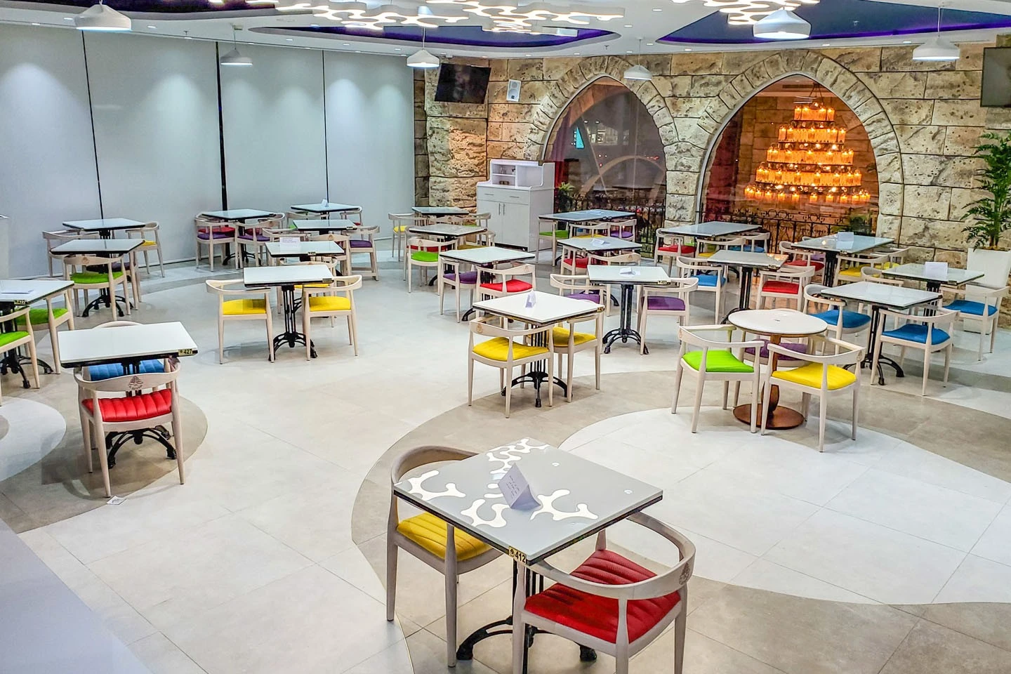 Colorful seating area at Al Meshwar Restaurant, Dubai.