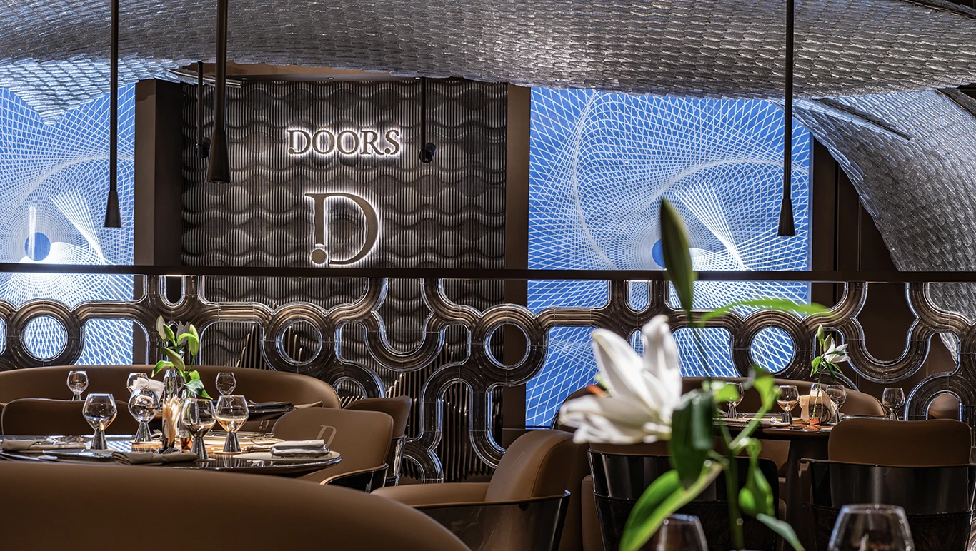 Sophisticated dining setup with artistic lighting at Doors Dubai Mall.