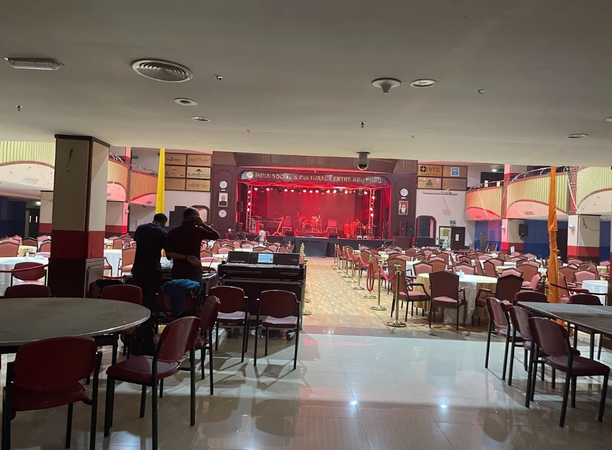 India Social & Cultural Centre Dubai, event setup with stage and seating.