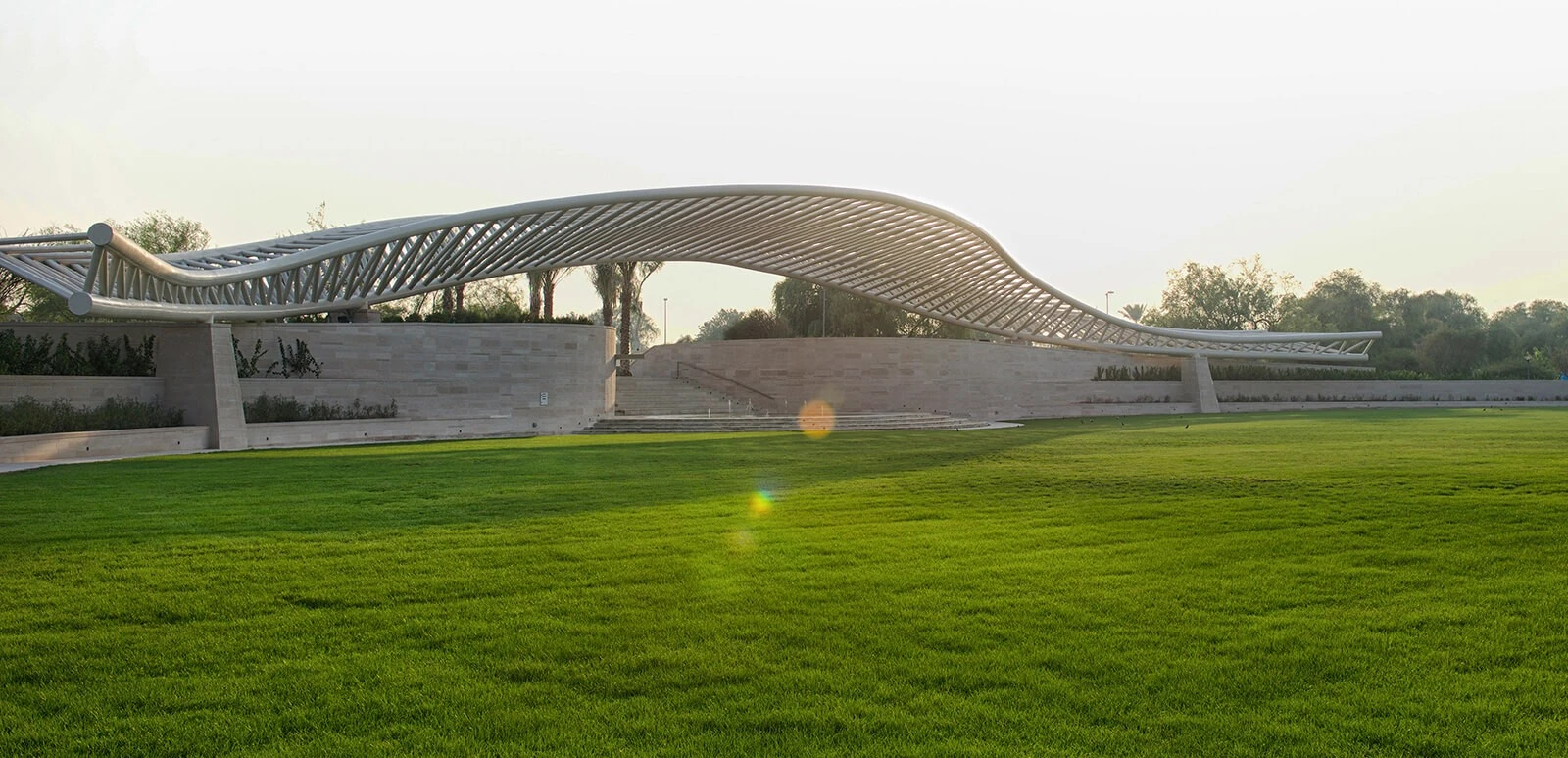 Modern amphitheatre with green lawn at Umm Al Emarat Park, Abu Dhabi.