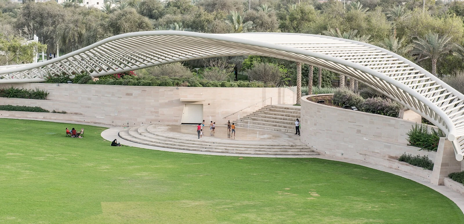 Amphitheatre at Umm Al Emarat Park, Abu Dhabi with lush greenery.