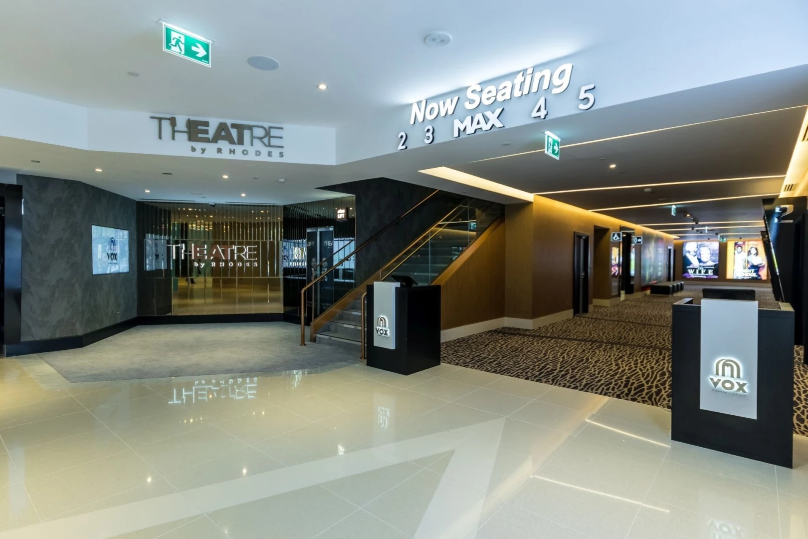 VOX Cinemas Al Jimi Mall entrance, Al Ain, modern interior design.