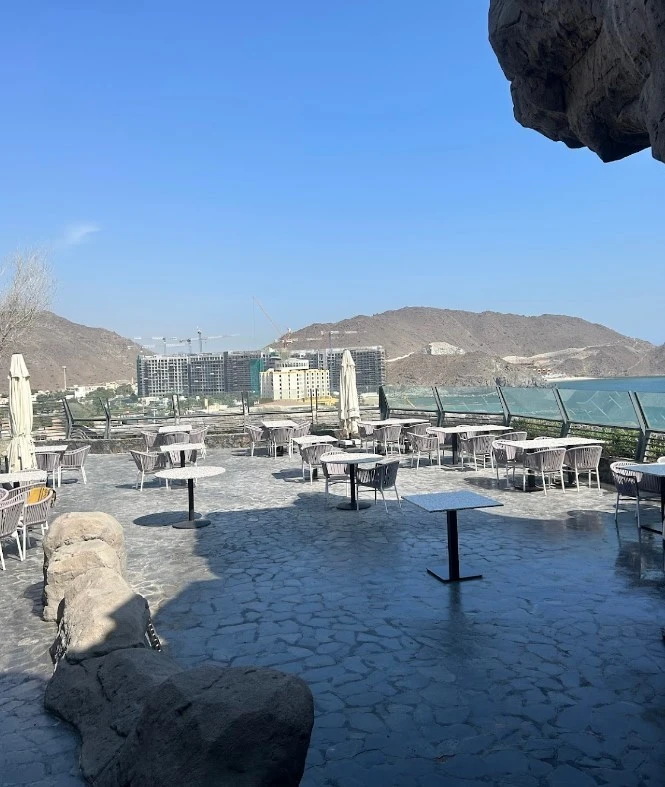 Outdoor seating at Habib Beirut Restaurant Khorfakkan, Sharjah with mountain view.