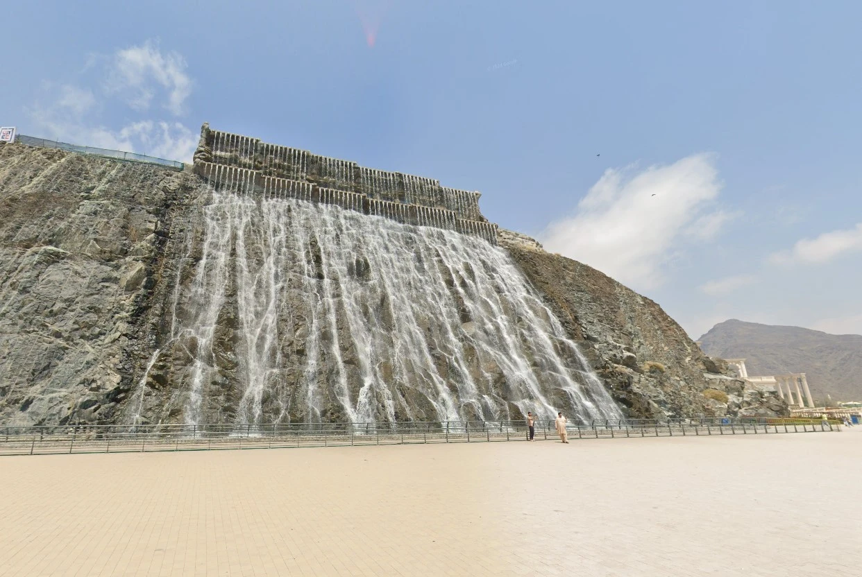 Khorfakkan waterfall near Habib Beirut Restaurant, Sharjah, under clear sky.