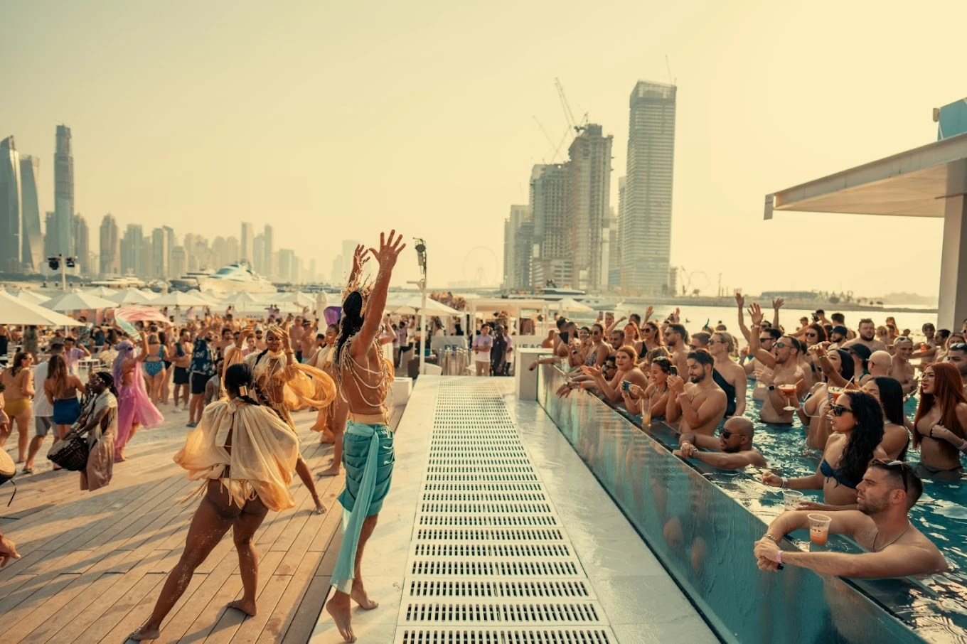 Crowd enjoying poolside party at Bohemia Beach Club Dubai.