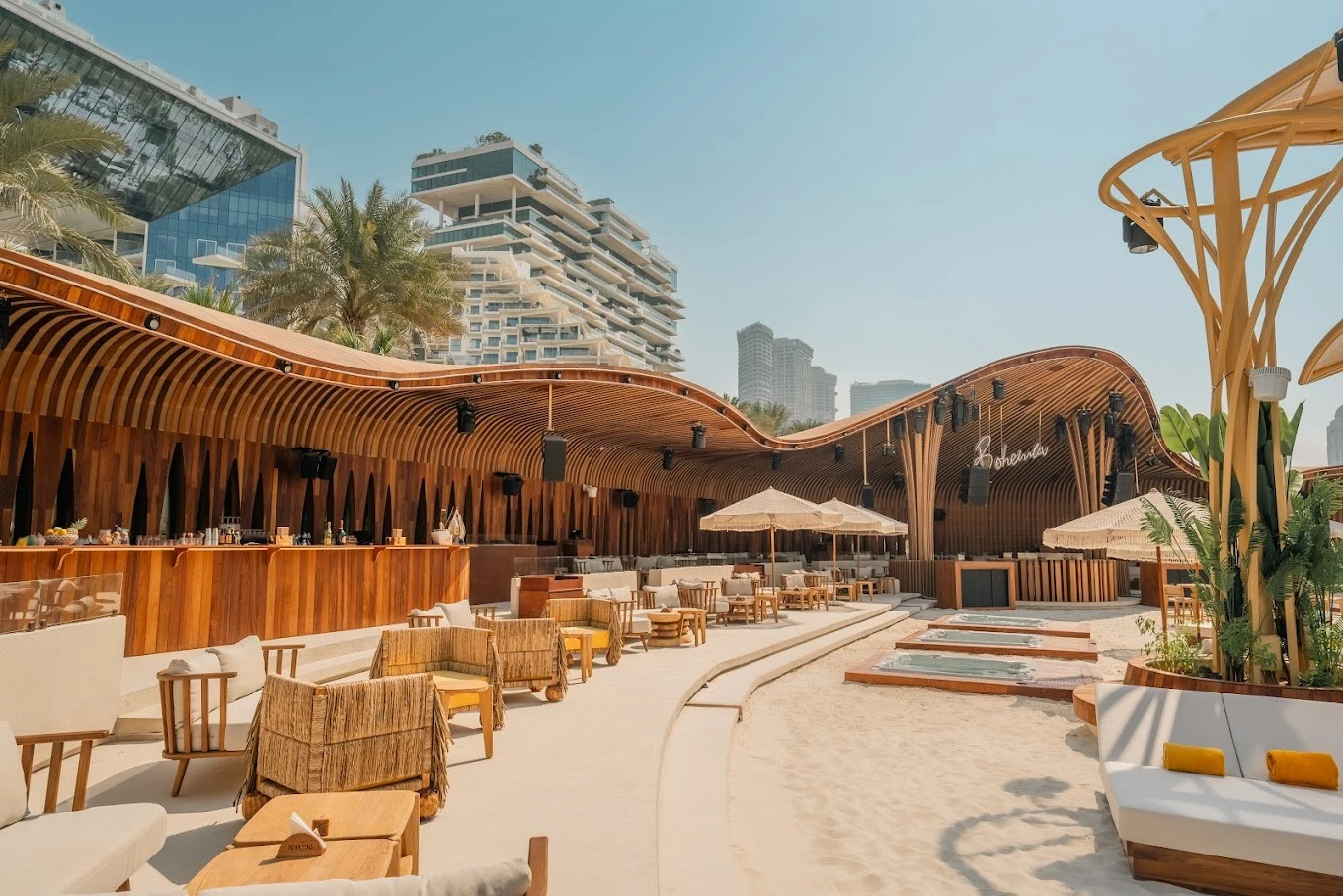 Bohemia Beach Club Dubai, outdoor seating with modern architecture.