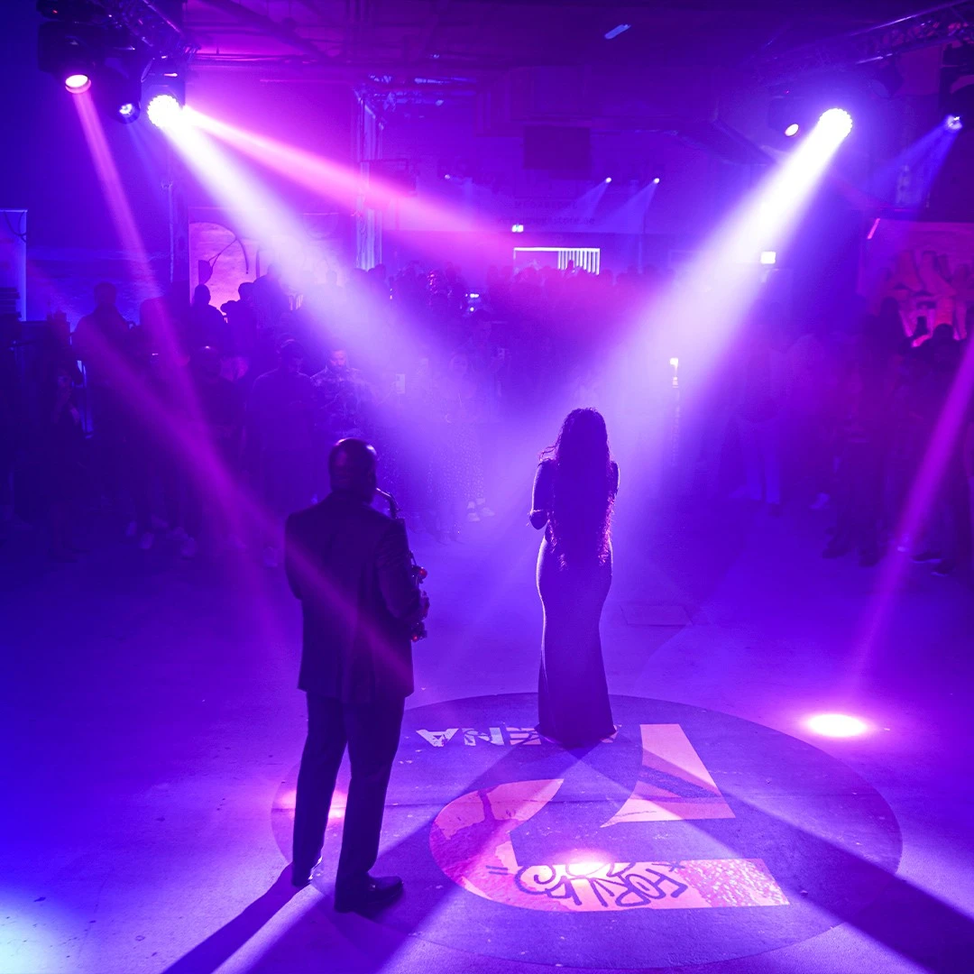 Performers on stage with purple lights at P7 Arena, Dubai.
