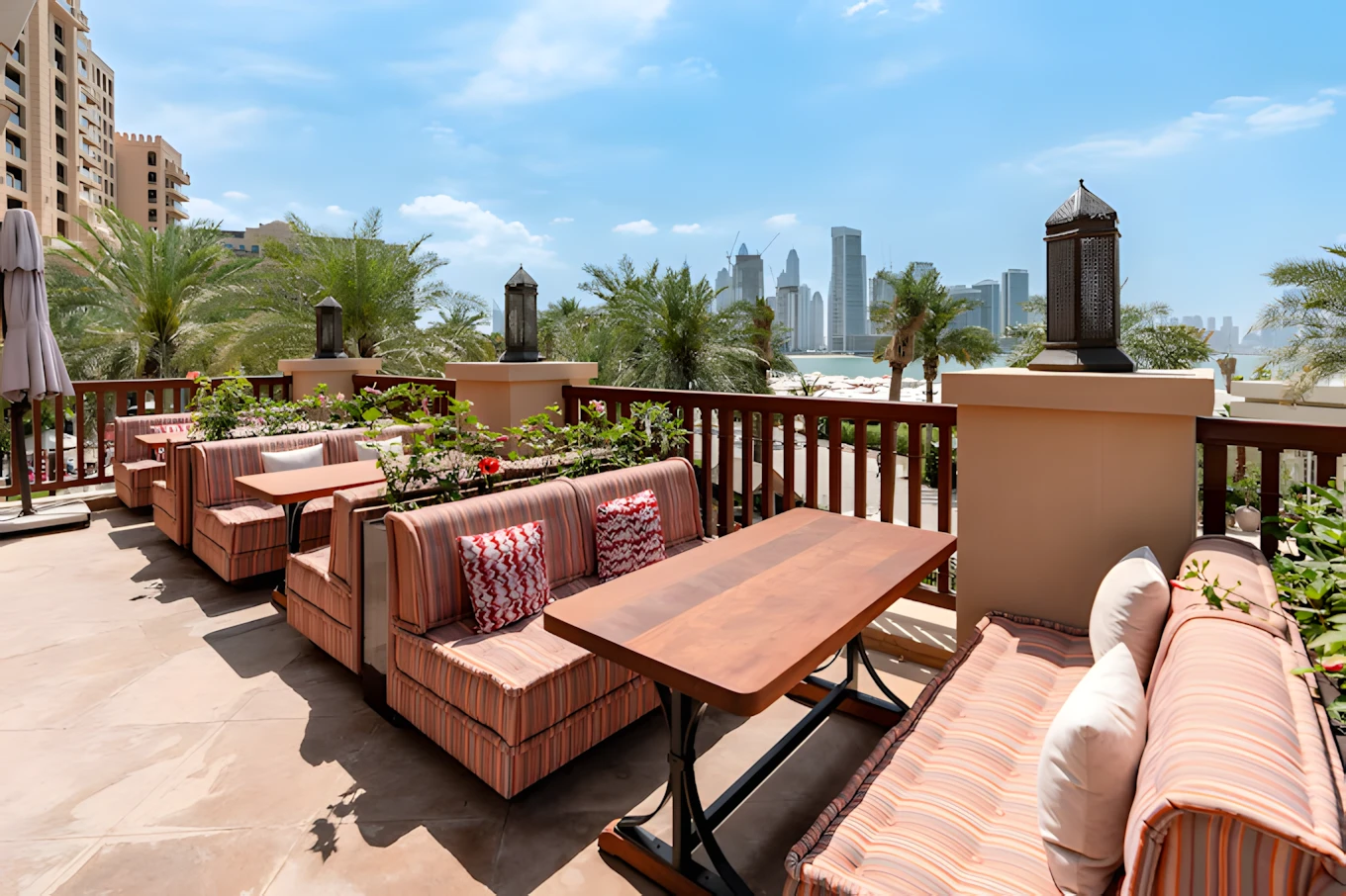 Outdoor seating at Grand Zor Restaurant Dubai with city skyline view.