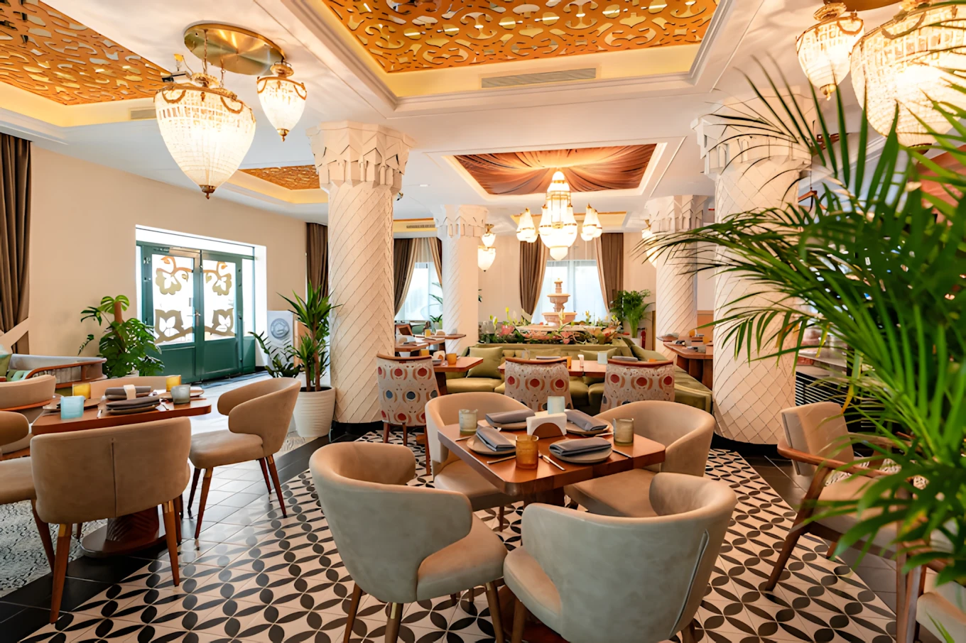 Elegant dining area at Grand Zor Restaurant Dubai with chandeliers.