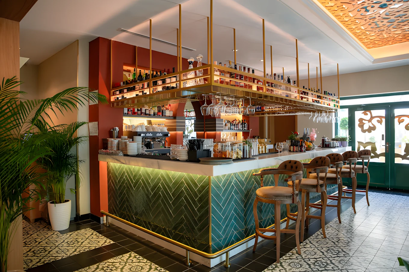 Stylish bar interior at Grand Zor Restaurant, Dubai with decorative tiles.