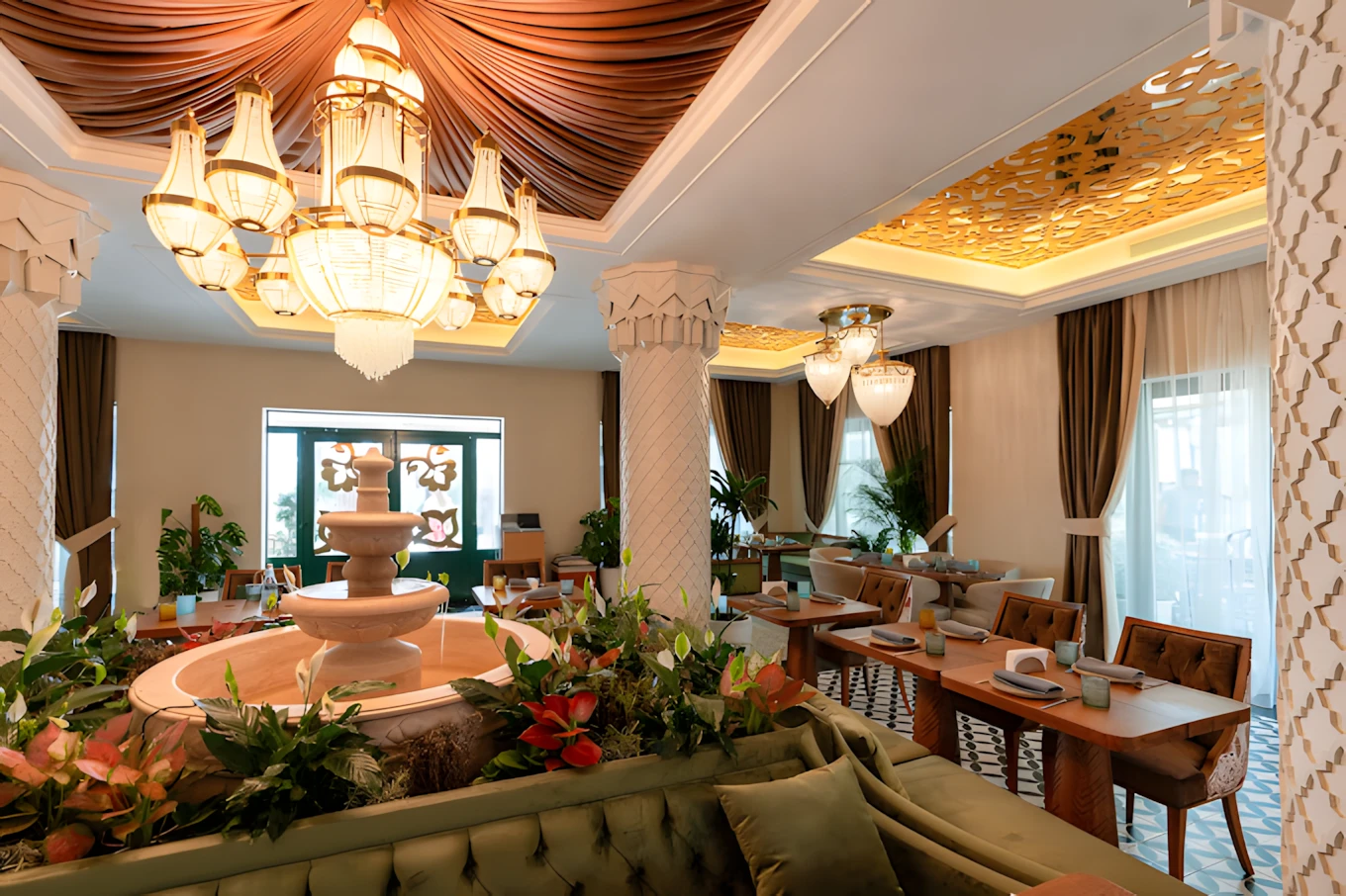 Elegant dining area at Grand Zor Restaurant Dubai with chandelier.