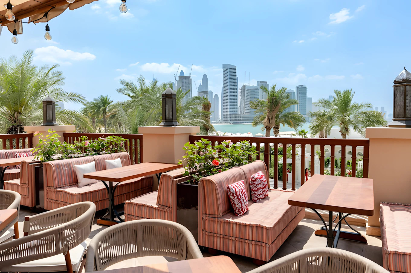 Outdoor seating at Grand Zor Restaurant Dubai with skyline view.