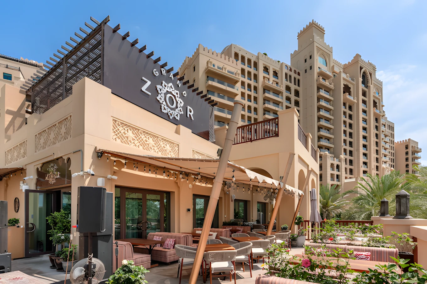 Grand Zor Restaurant Dubai outdoor seating with cityscape background.