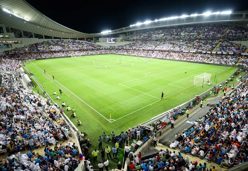 Crowded Hazza Bin Zayed Stadium during a football match in Al Ain.