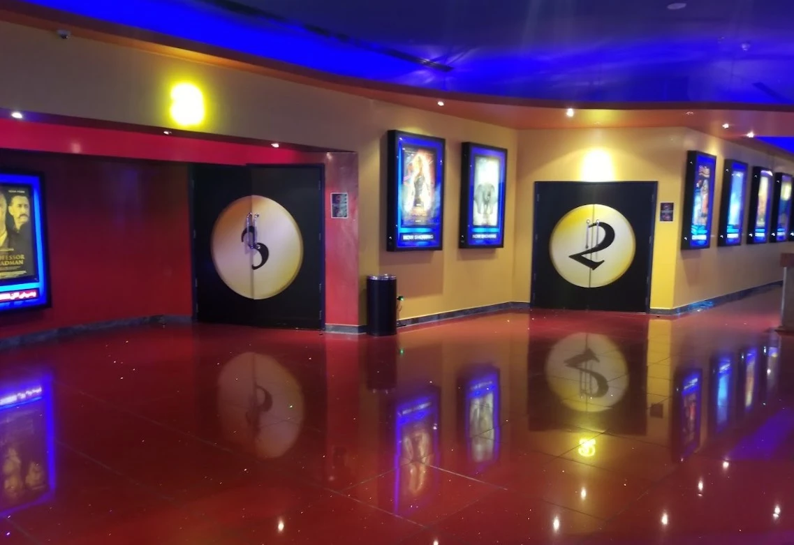 Star Cinemas Al Ain Mall entrance with movie posters.