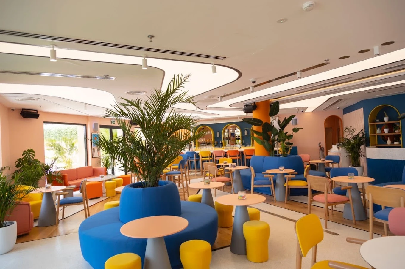 Colorful seating area at Peaches & Cream Beach Restaurant, Dubai.