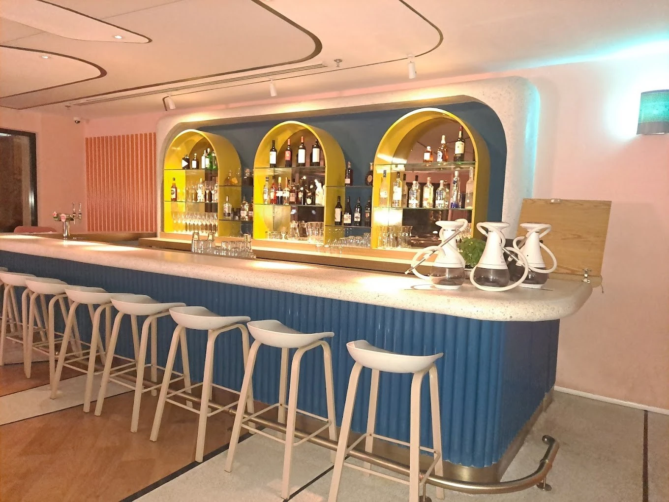 Stylish bar interior at Peaches & Cream Beach Restaurant, Dubai.