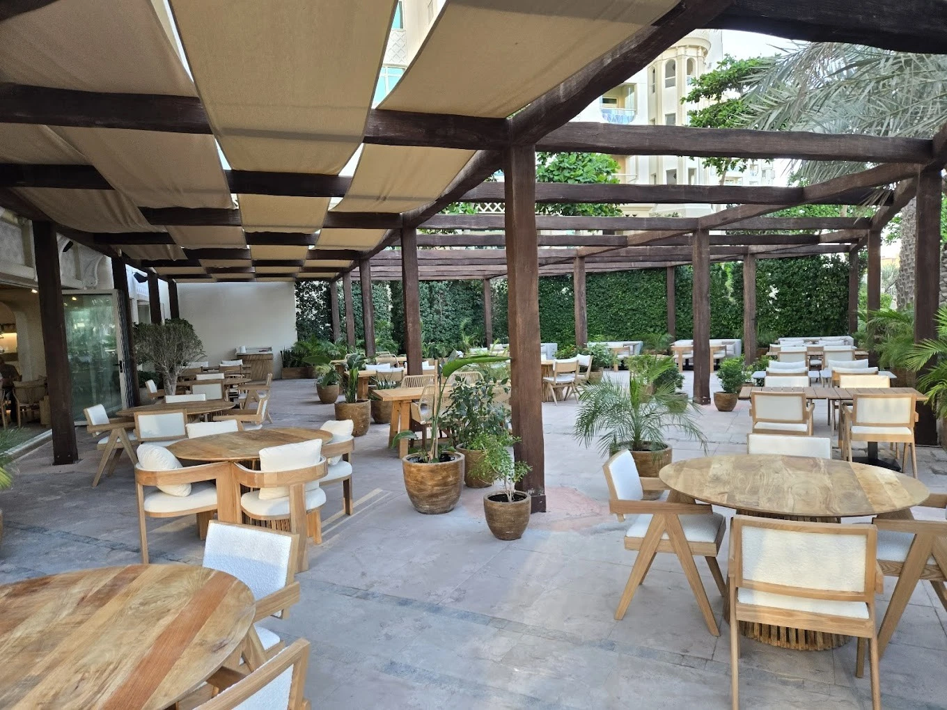 Outdoor seating at Peaches & Cream Beach Restaurant, Dubai.