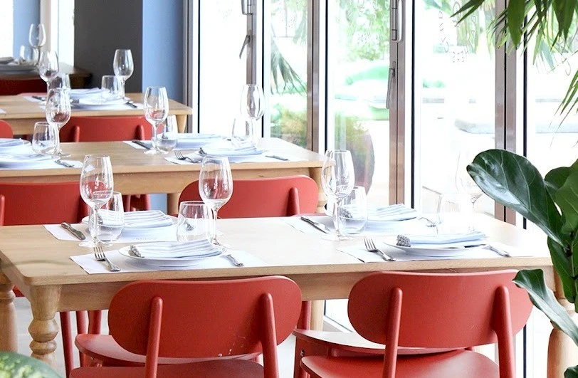 Elegant dining setup at The Byron Bathers Beach Club, Dubai.
