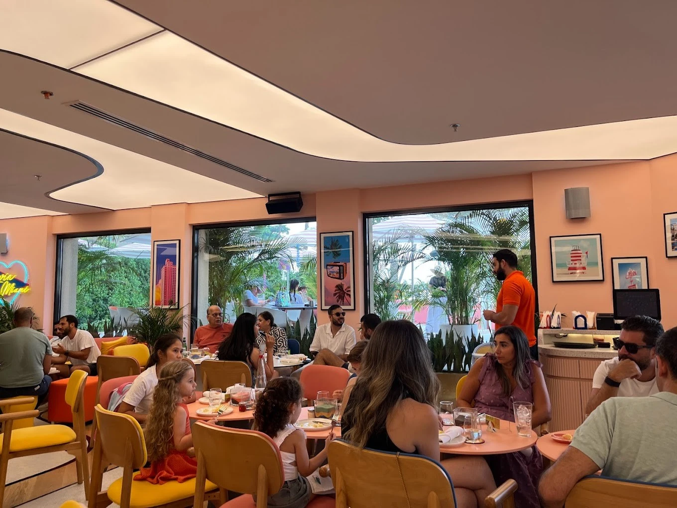 Peaches & Cream Beach Restaurant Dubai, lively indoor dining scene.