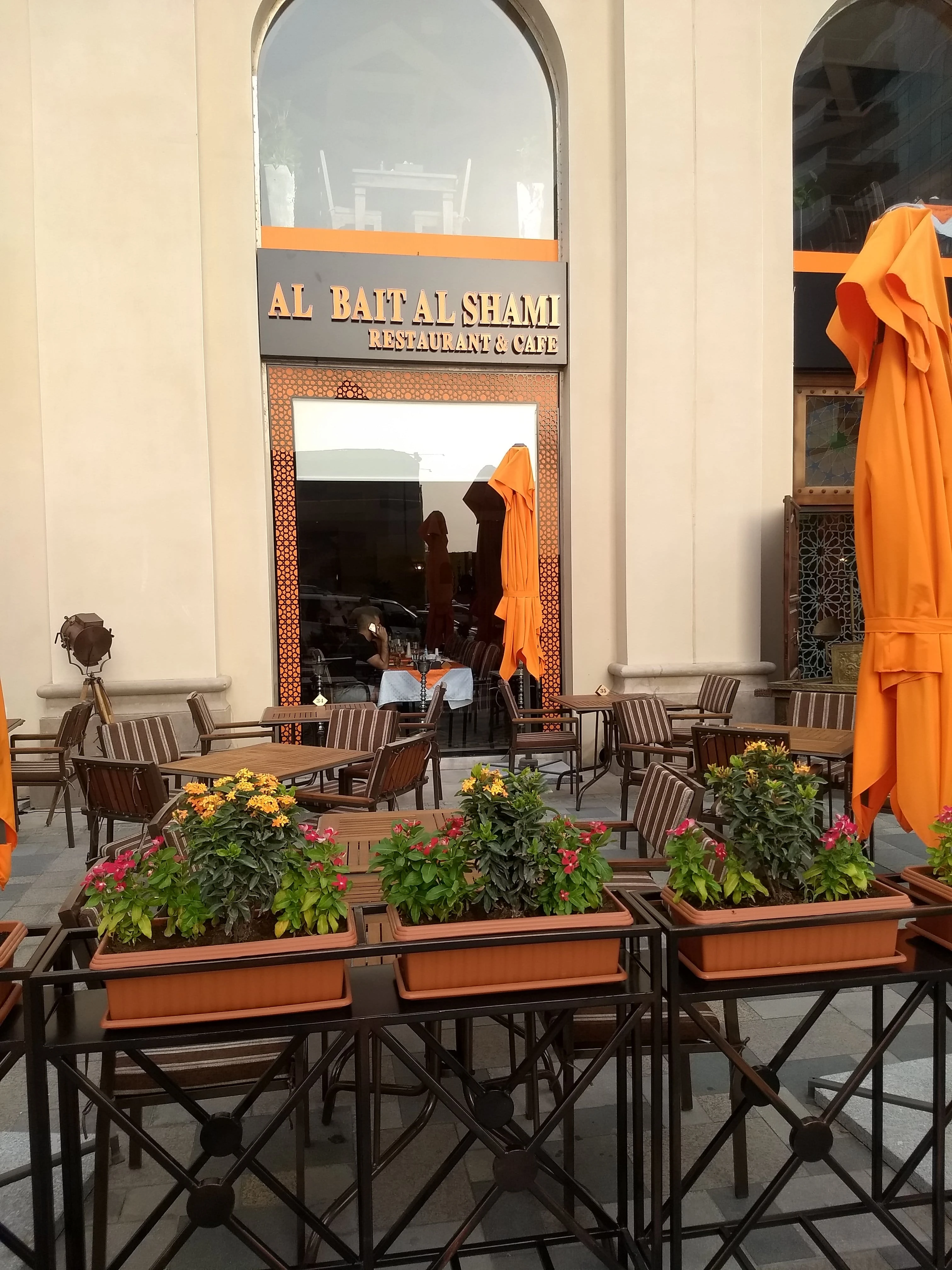 Flower-adorned patio at Al Bait Al Shami, Dubai.