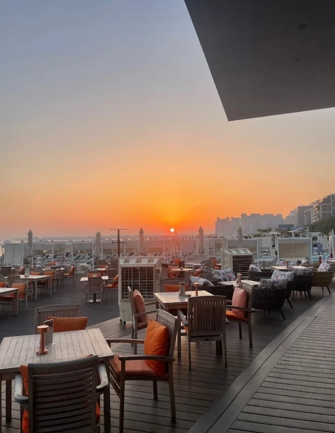 Sunset view from Orange Chameleon Restaurant & Lounge, Dubai terrace.