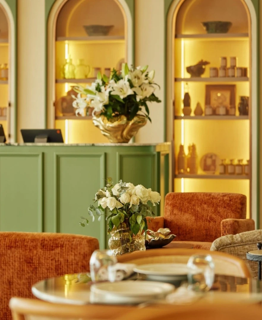 Elegant interior of Sufret Maryam Restaurant, Dubai with floral decor.