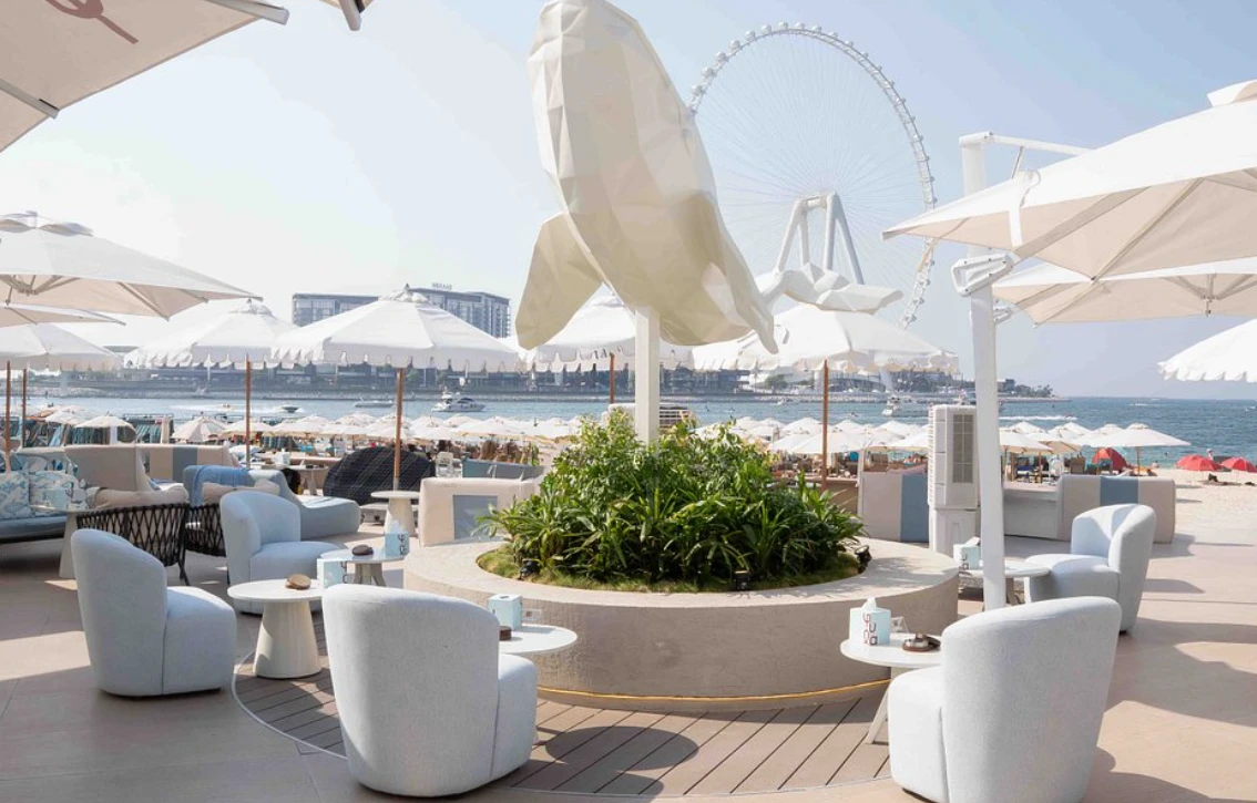 Yula Lounge outdoor seating with Dubai Ferris wheel view.
