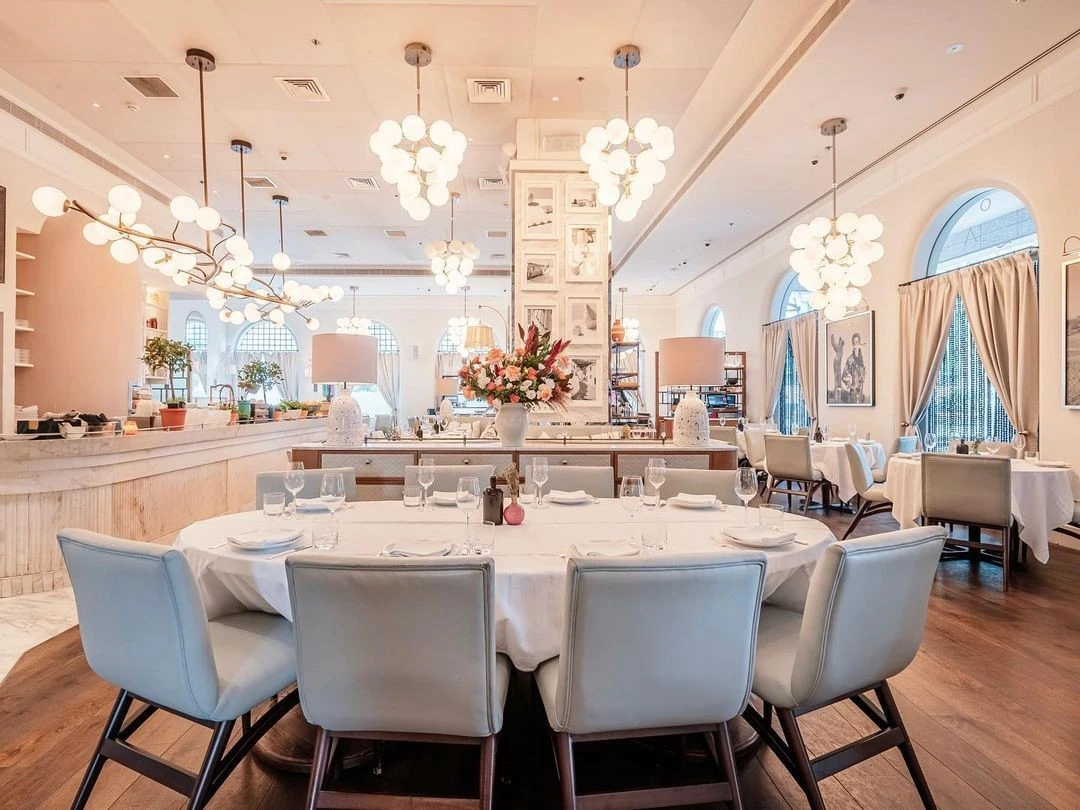 Elegant dining area at Gaia Dubai with modern decor and lighting.