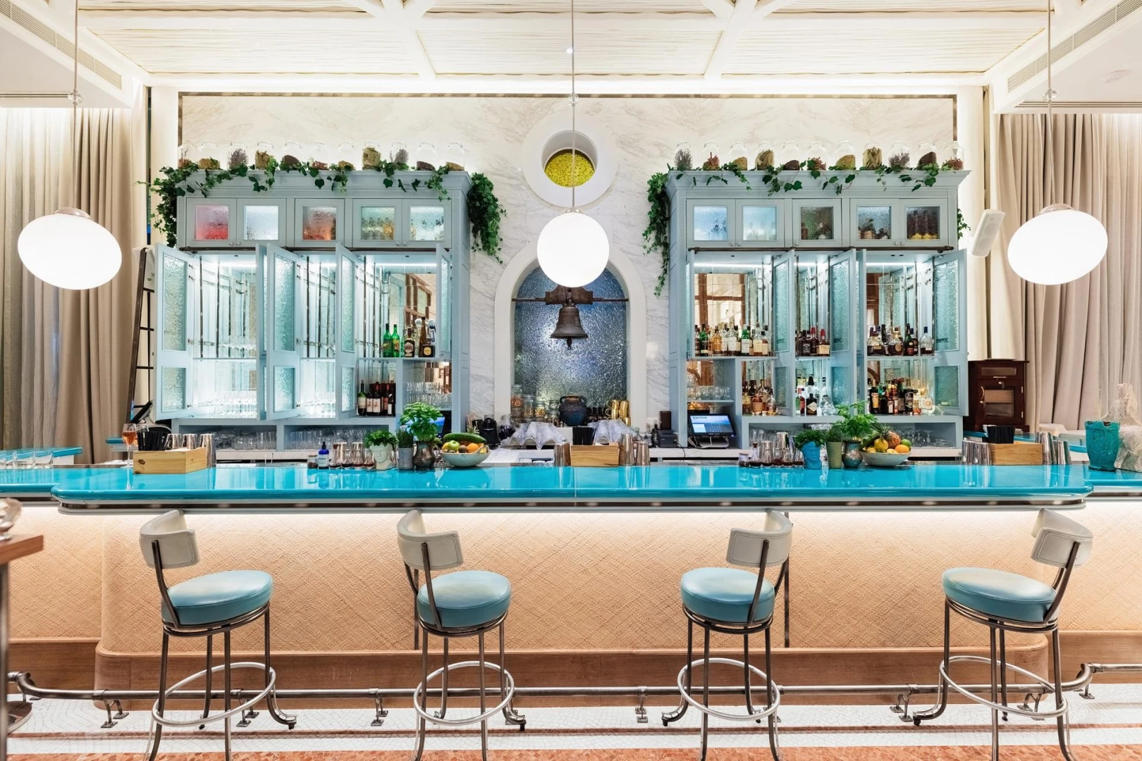 Gaia Dubai bar with turquoise counter and elegant decor.