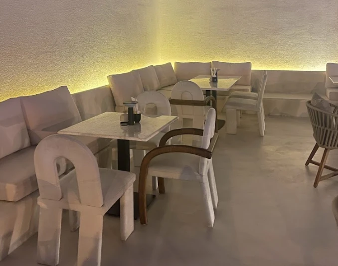 Lune Lounge Dubai, cozy seating with soft lighting and tables.