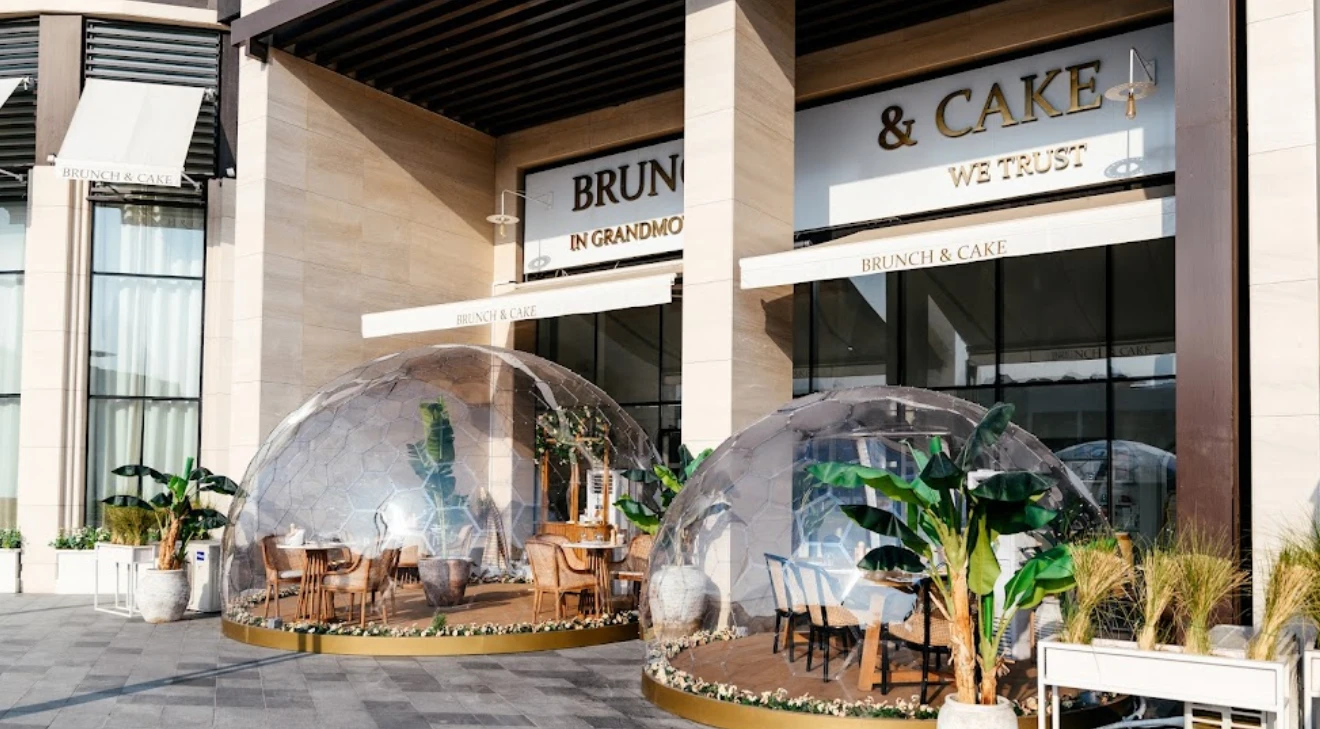 Brunch & Cake Wasl 51 Dubai outdoor seating with glass domes.