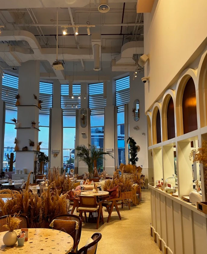Cozy interior of Brunch & Cake Wasl 51, Dubai with elegant decor.